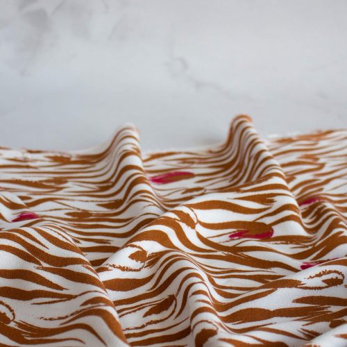 Floral zebra viscose crepe fabric in caramel colour