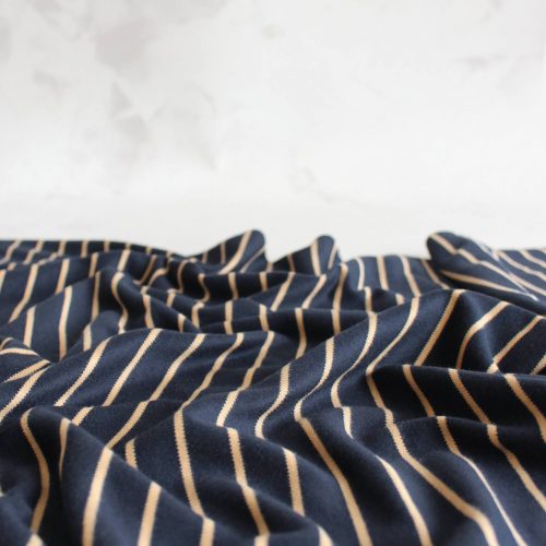 Navy striped knit fabric with tan lines
