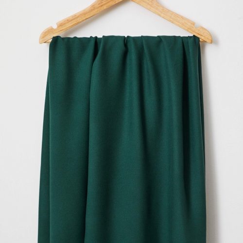 Green fabric hanging on hanger