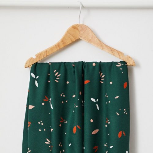 Petal print ecovero fabric in green on hanger by Mind the Maker