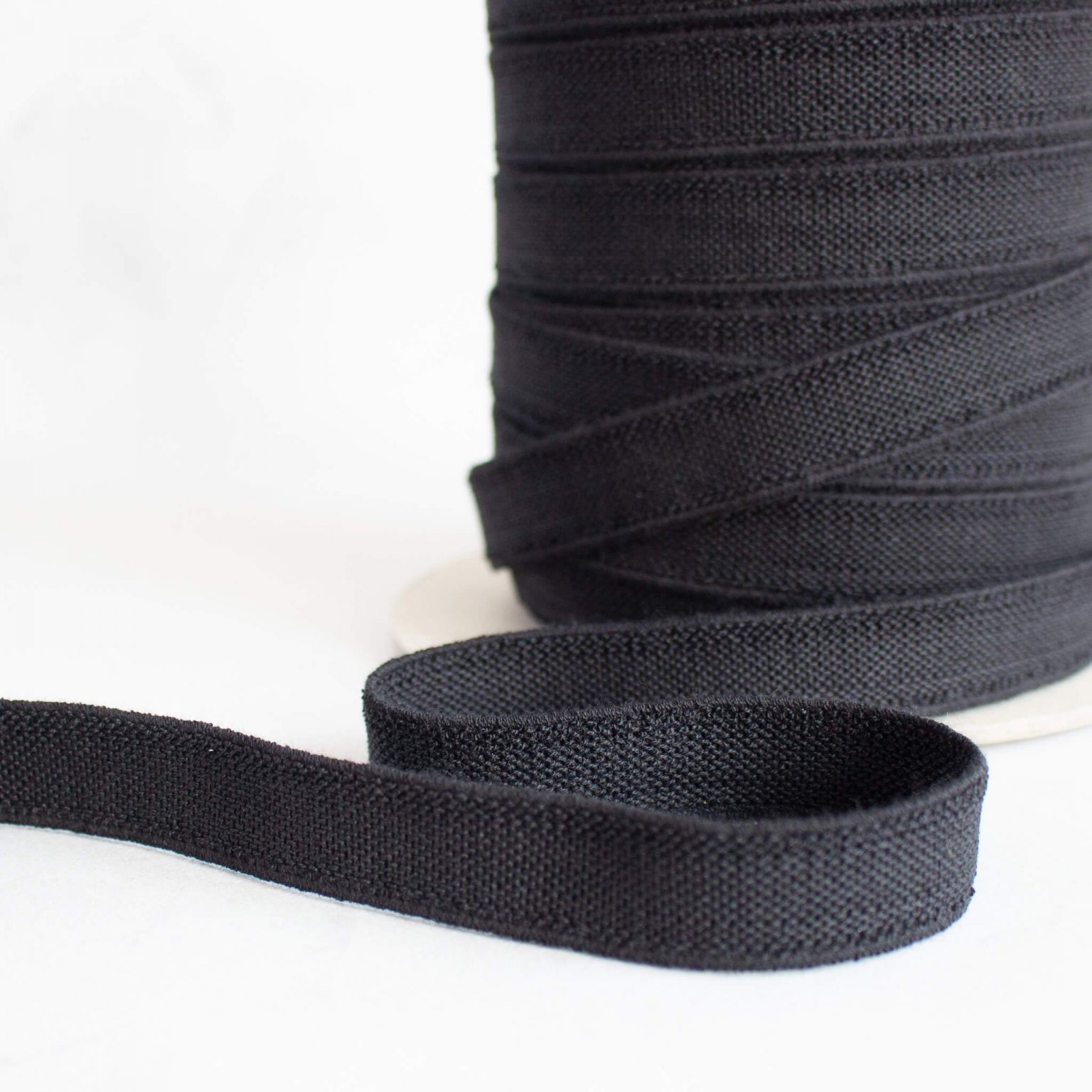 Black elastic on a roll slightly unrolled