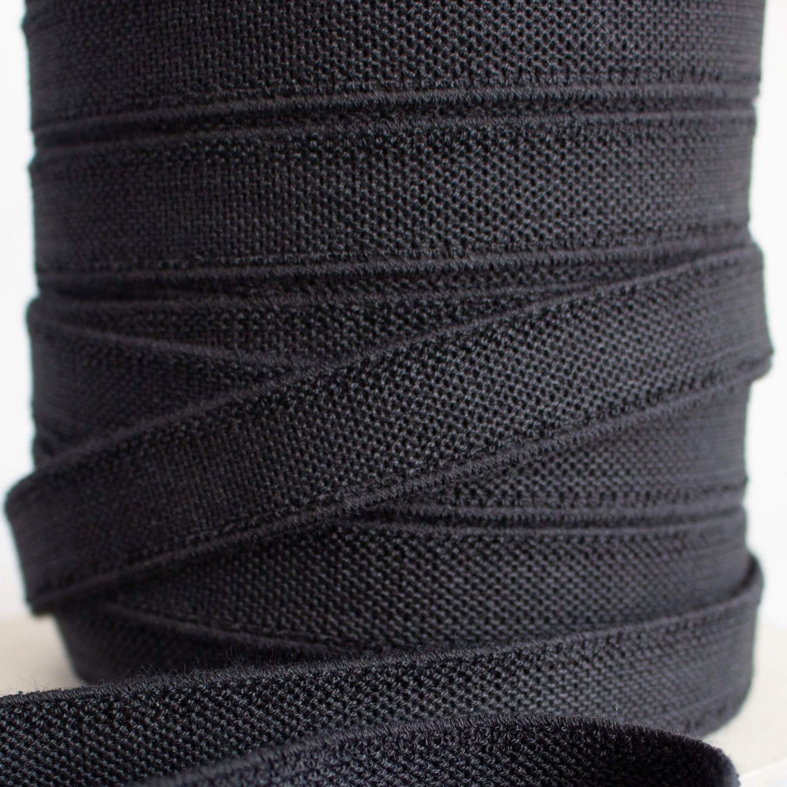 Black elastic on a roll close up of the texture