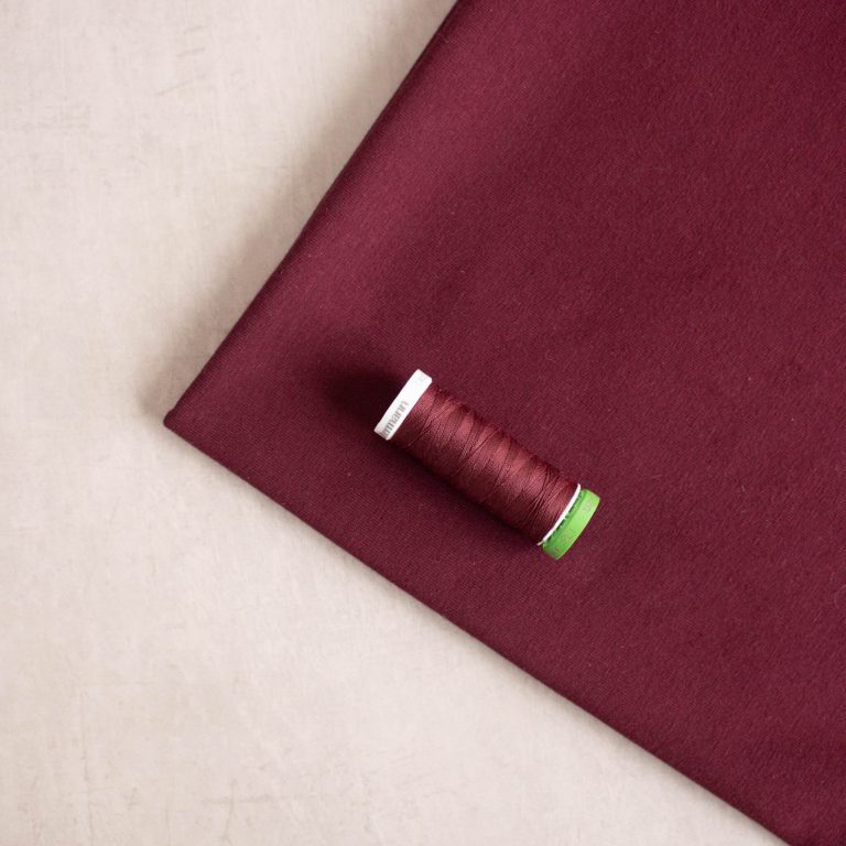 Burgundy organic cotton jersey fabric with matching thread