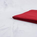 Tencel modal jersey in cherry red folded neatly