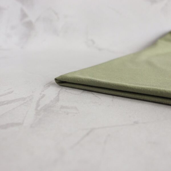 Sage tencel jersey neatly folded