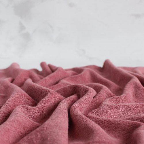 Dark rose cotton towel fabric close up view