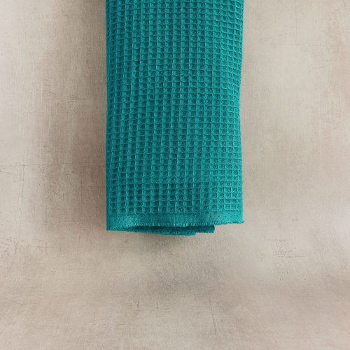 Teal waffle cotton fabric hanging straight