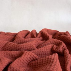 cotton waffle fabric in brick red