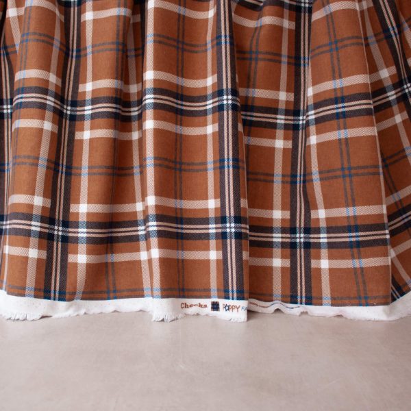 flannel fabric in rust and blue check print