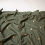Cotton Jersey Fabric with Golden Flowers in Olive Green