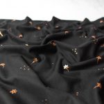 Cotton Jersey Fabric with Golden Flowers in Black