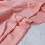 Soft brushed organic cotton sweat fabric in warm Peachy Pink colour
