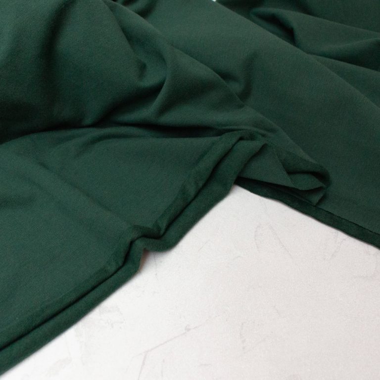 Soft brushed organic cotton sweatshirt fabric in forest green