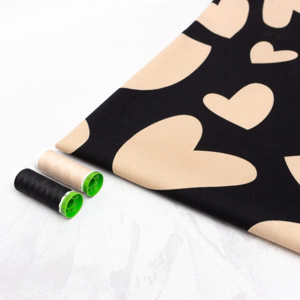 Cotton Denim Fabric with Stretch in Black with Cream Hearts