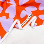 lilac and orange heart print denim fabric