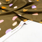 Nerida Hansen Cotton Sateen Fabric in Olive Summer Spots