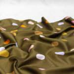 Nerida Hansen Cotton Sateen Fabric in Olive Summer Spots