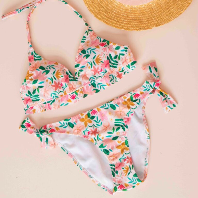 bikini in floral print next to a sunhat