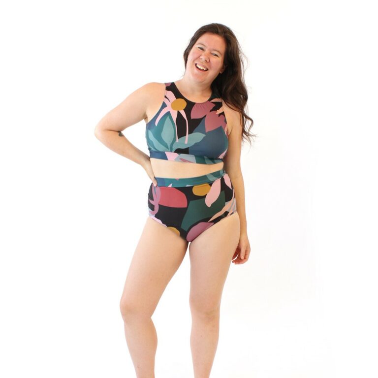 model wearing sporty two piece swimsuit