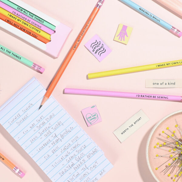 colourful pencils and notebook scattered around
