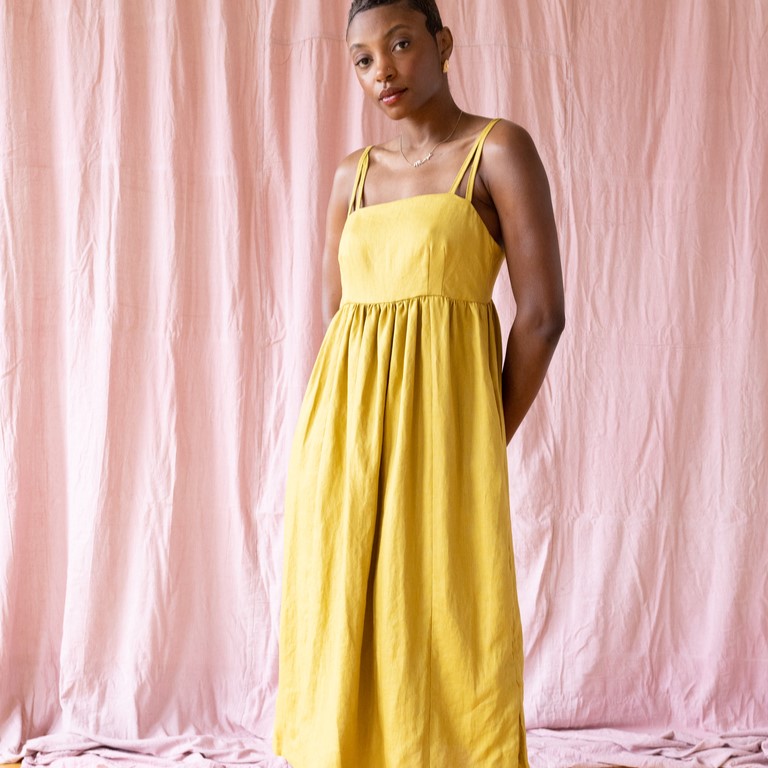 model wearing strappy yellow sundress