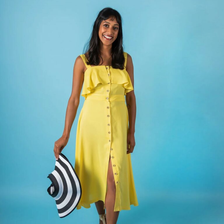 woman wearing yellow knee length sundress