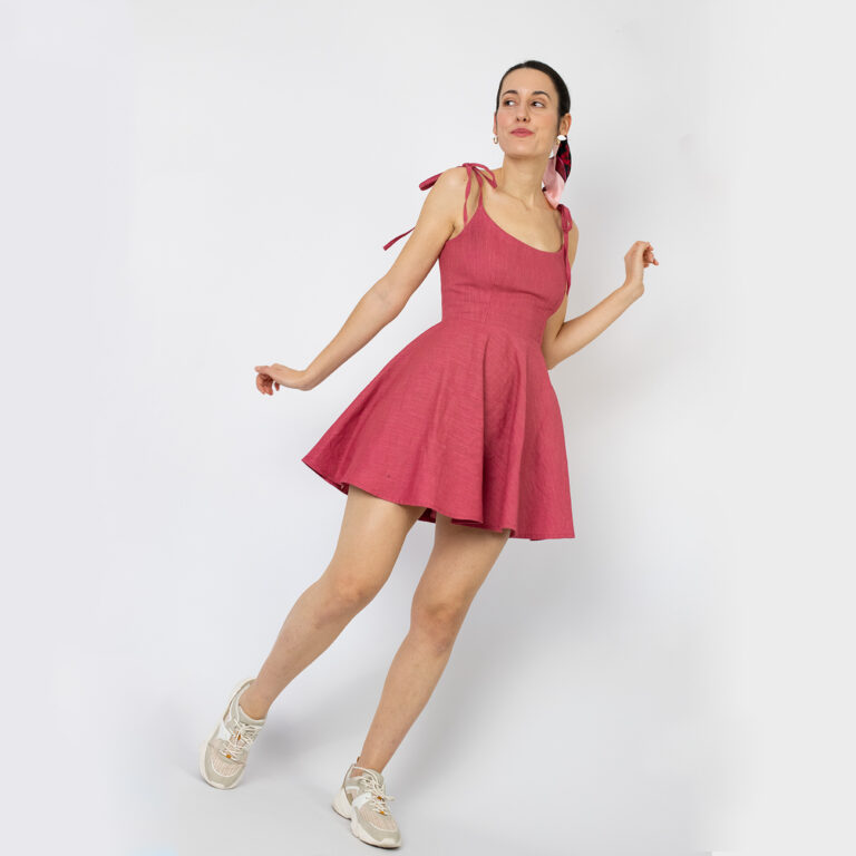 model wearing short red dress