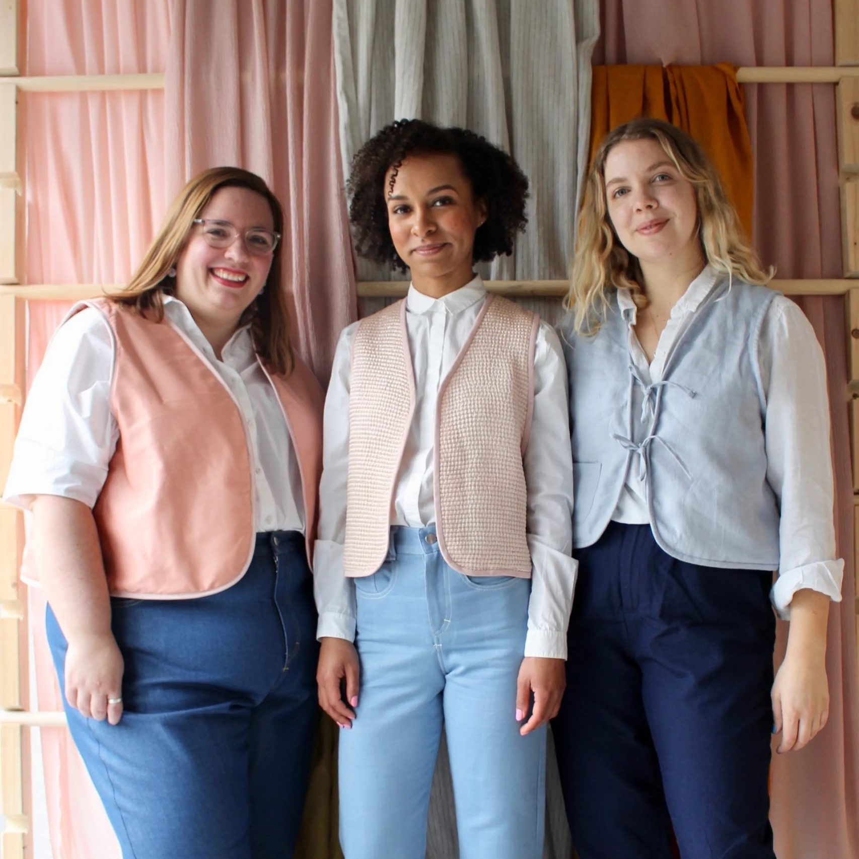 3 women wearing waistcoats