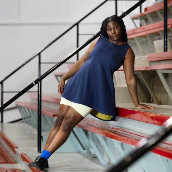 model wearing navy blue sports dress