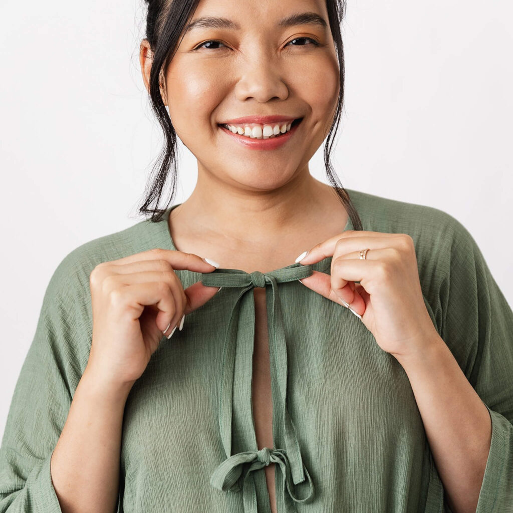 model wearing green tunic