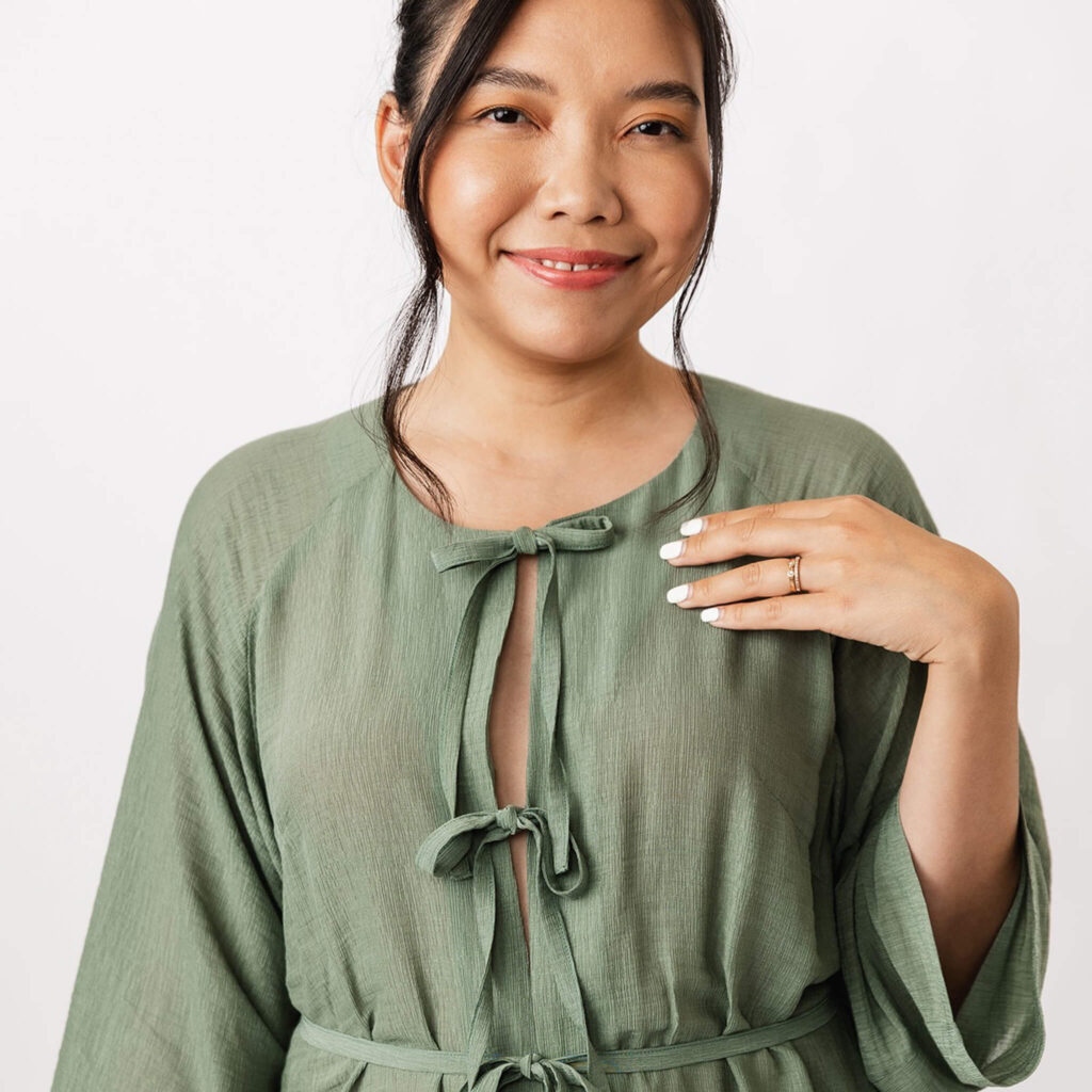 model wearing green tunic