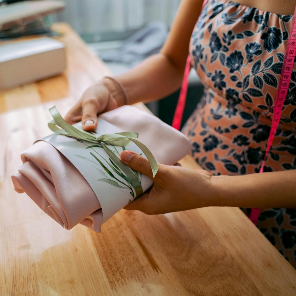 woman holding folded fabric