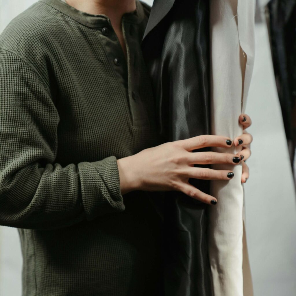 woman holding fabric rolls