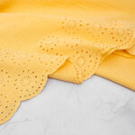 Broderie Double Gauze Fabric with Scalloped Edge in Butter Yellow