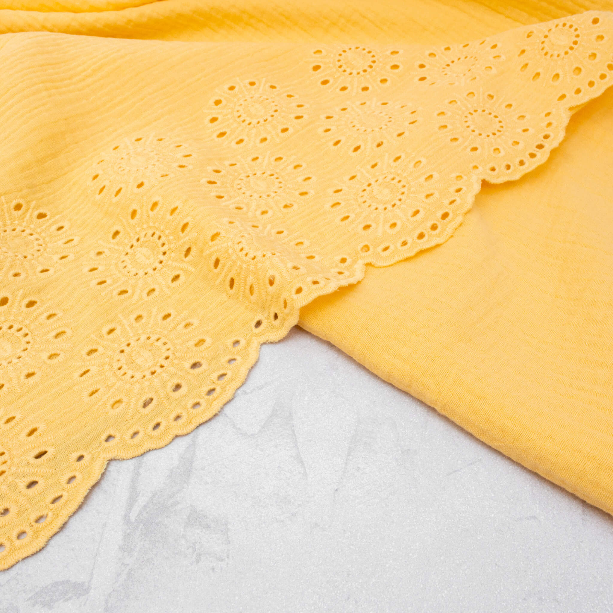 Broderie Double Gauze Fabric with Scalloped Edge in Butter Yellow