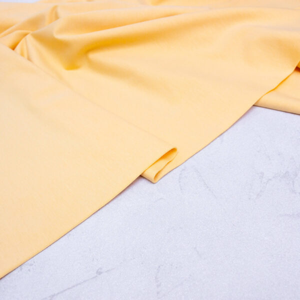 Organic Cotton Jersey Fabric in Buttermilk Yellow