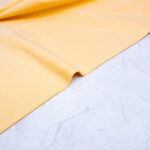Organic Cotton Jersey Fabric in Buttermilk Yellow